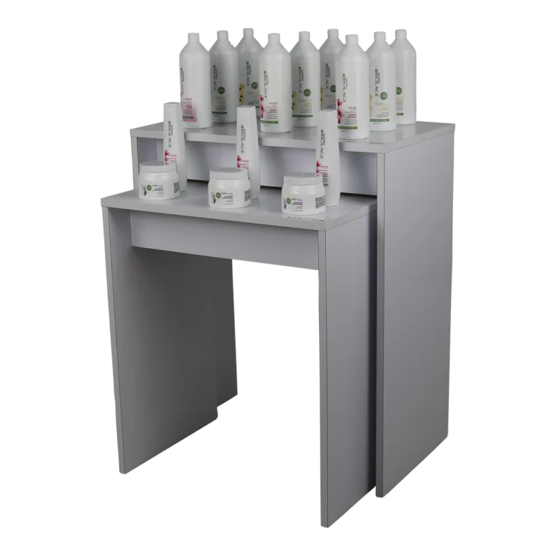 Kaemark A Nesting Tables Product Display with several bottles on it.