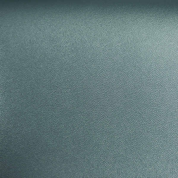 Kaemark A close up image of a blue leather surface.