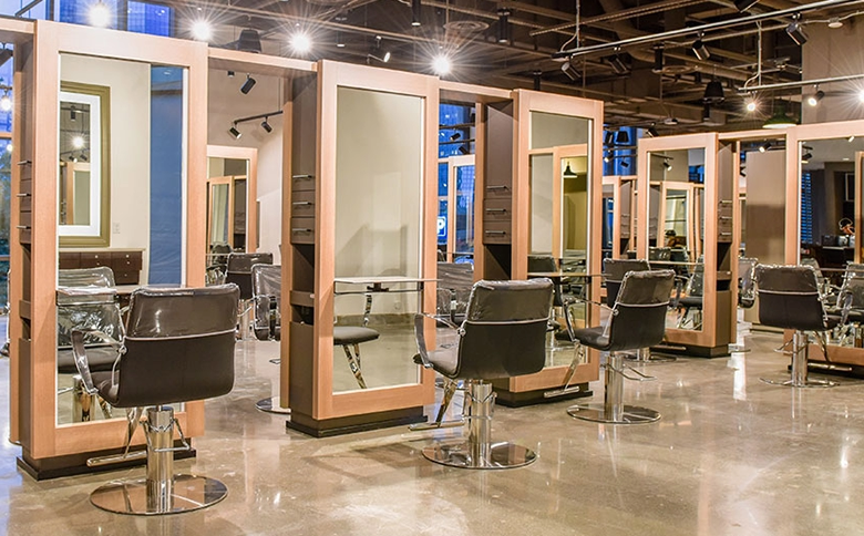Kaemark A Kaemark hair salon with multiple chairs and mirrors.