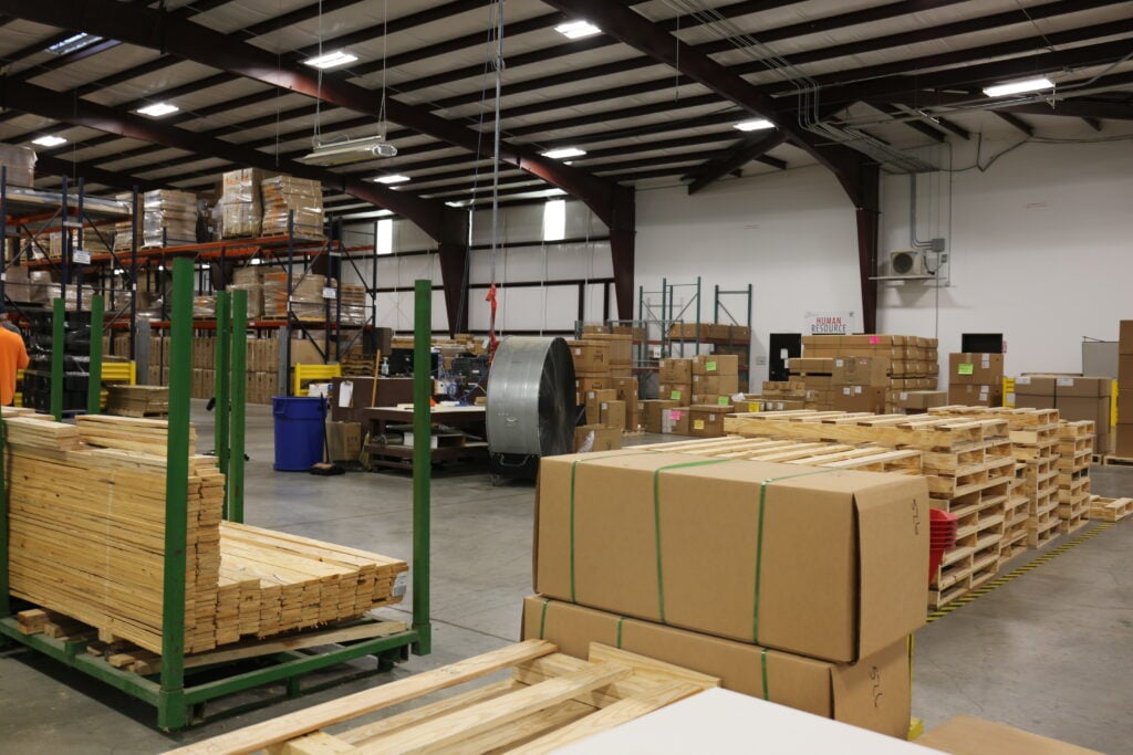 Kaemark Wooden pallets in a warehouse.