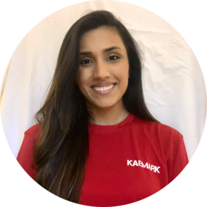 Kaemark A young woman in a red t - shirt smiling.