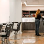 Stylist working on a client's hair in Beautique Houston Salon and Spa
