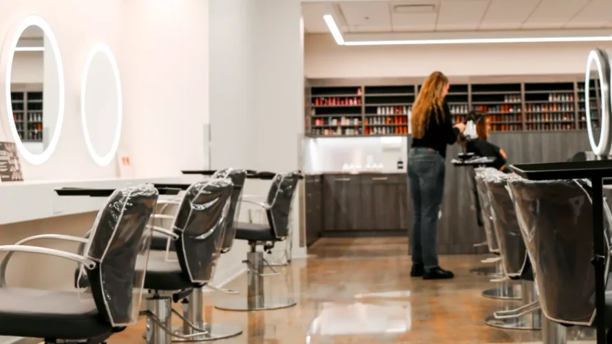 Stylist working on a client's hair in Beautique Houston Salon and Spa